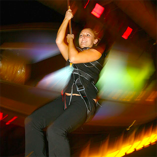 Woman indoor bungee jumping Woman indoor bungee jumping